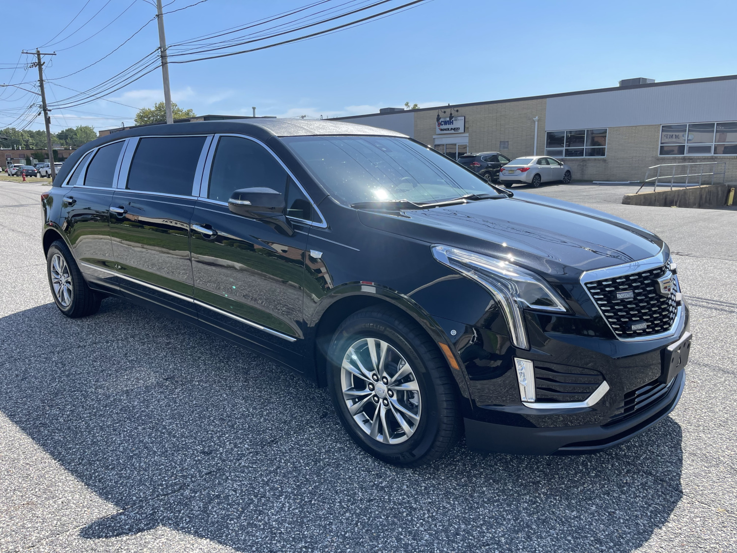 2024 CADILLAC RAISED ROOF SIX DOOR FUNERAL LIMOUSINE - Specialty Hearse